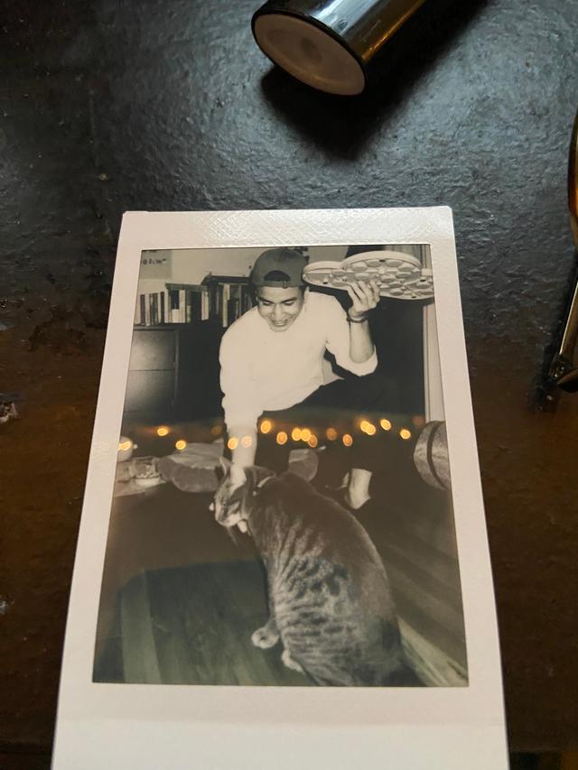 Picture of my cat and I in a polaroid